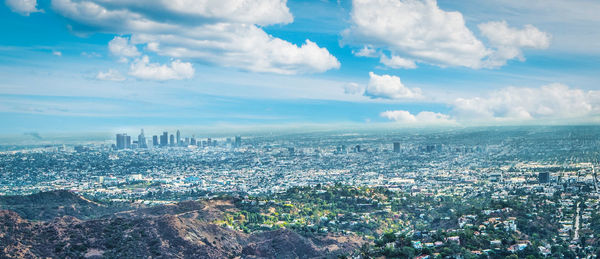 High angle view of city buildings against sky