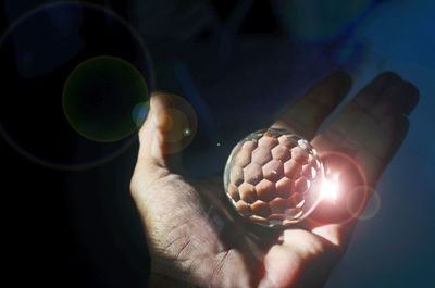 Close-up of hand holding ice cream