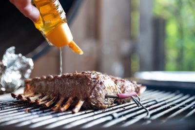 Close-up of meat cooking on barbecue grill