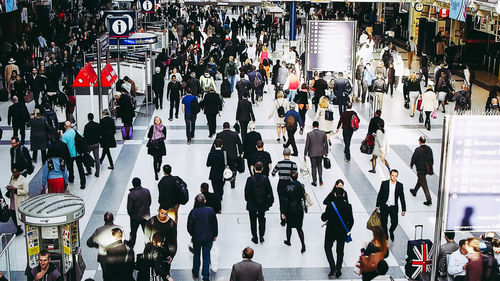 High angle view of people walking on street in city