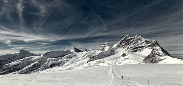 Scenic view of snowcapped mountains against sky