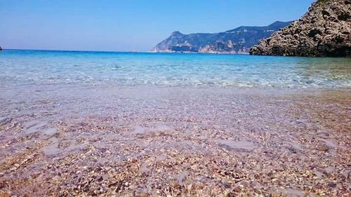 Scenic view of sea against clear blue sky