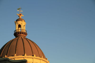 Low angle view of traditional building against clear blue sky