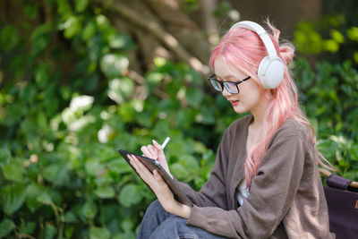 Young woman using mobile phone