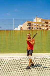 Full length of man playing tennis