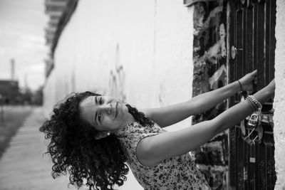 Portrait of a young woman standing outdoors