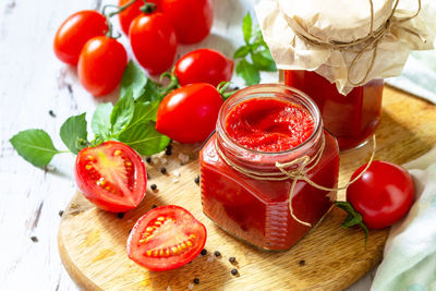 High angle view of fruits in glass jar on table