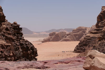 Rock formations on landscape in wadi rum against clear sky