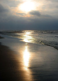 Scenic view of sea against sky at sunset