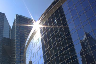 Low angle view of modern buildings against clear sky