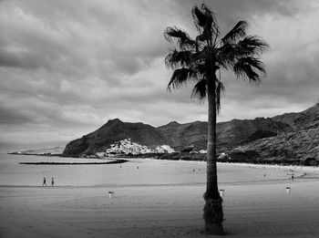 Scenic view of mountains against cloudy sky