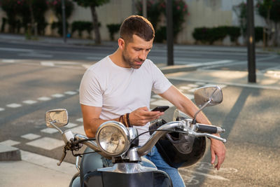 Man riding bicycle on road