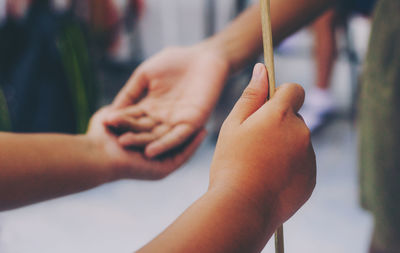 Close-up of hand holding hands