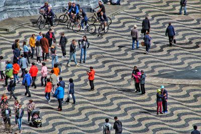 High angle view of people on patterned footpath