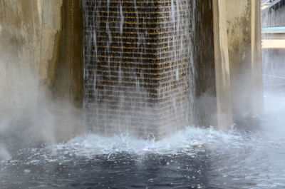 Water splashing on wall of building