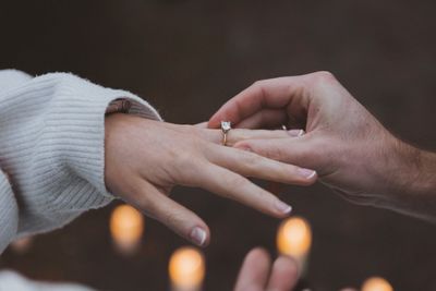 Cropped image of man holding hands