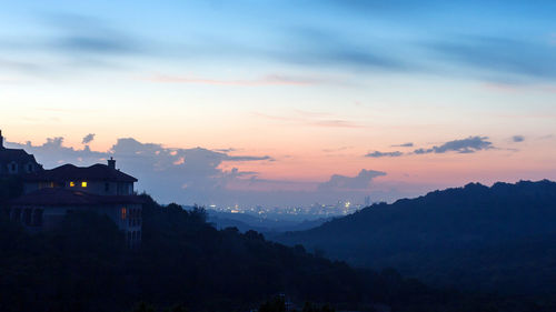 Scenic view of mountains against sky during sunset