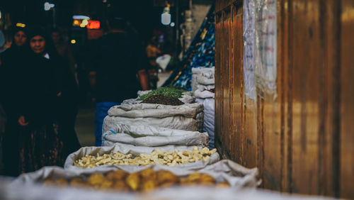 Man for sale at market stall