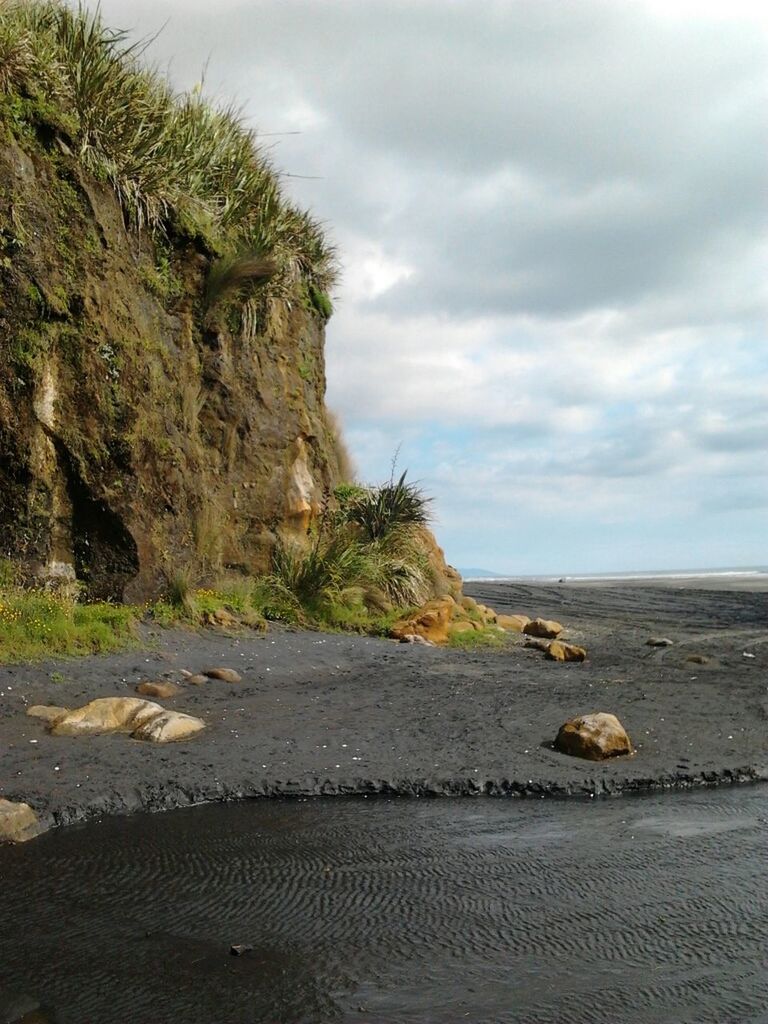 sky, sea, beach, cloud - sky, water, tranquil scene, tranquility, scenics, cloudy, beauty in nature, nature, rock - object, shore, cloud, horizon over water, rock formation, sand, idyllic, non-urban scene, tree