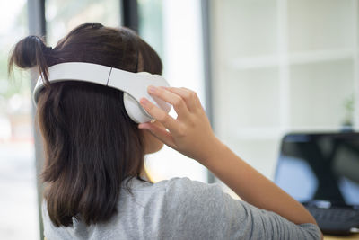 Girl listening music indoors