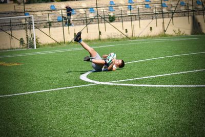 Man playing soccer on field