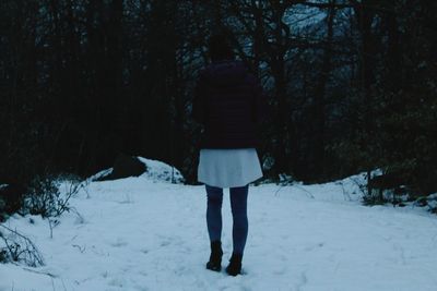 People standing on snow covered landscape