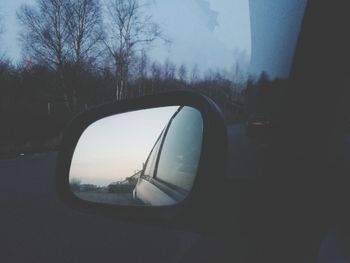 Reflection of car on side-view mirror