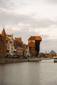 Ancient crane - zuraw old town in gdansk. the riverside on granary island reflection in moltawa