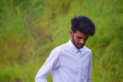 Fashionable man standing on field