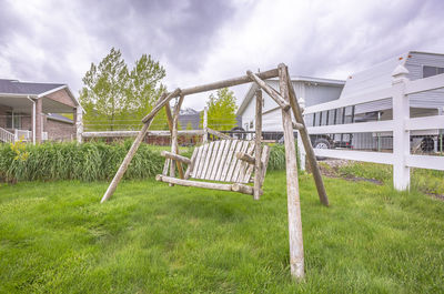 Traditional windmill on field against sky