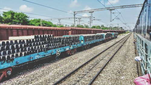 Train on railroad tracks against sky