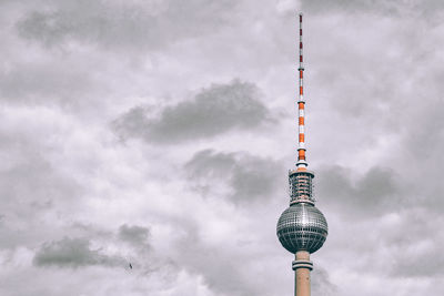 Berlin television tower against cloudy sky