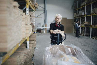 Full length of woman sitting on floor