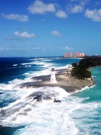 Scenic view of sea and buildings against sky