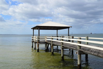 Pier on sea against sky