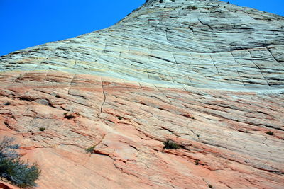 Low angle view of rock formation against clear sky