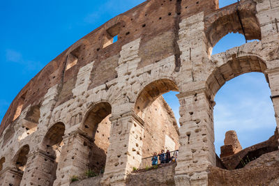 Tourists visiting the famous colosseum or coliseum also known as the flavian amphitheatre