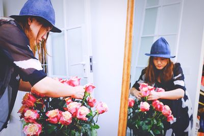 Portrait of young woman holding bouquet