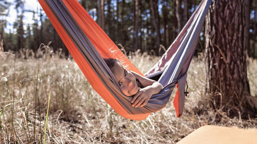 High angle view of person lying on hammock