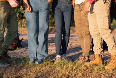 Group of people wearing sturdy shoes and thick trousers to protect against ticks and mosquitoes