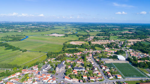 Aerial view of agricultural field against sky