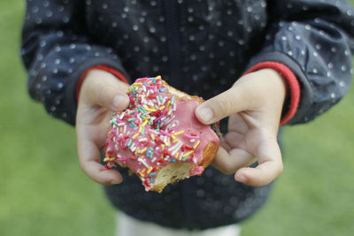 Close-up of hand holding ice cream