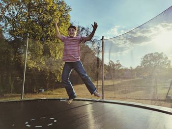 Full length of boy jumping outdoors