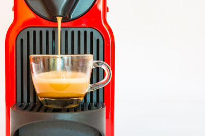 Close-up of coffee cup against white background