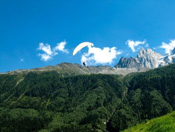 Scenic view of mountain against blue sky