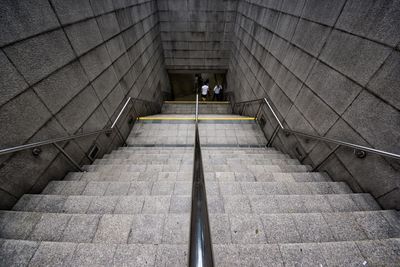 Low angle view of people on staircase