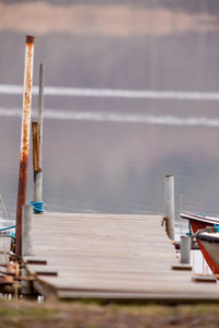 Close-up of wooden post against sea