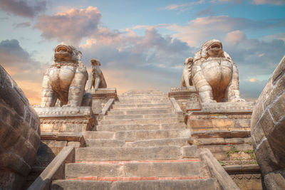 Rear view of man standing on steps