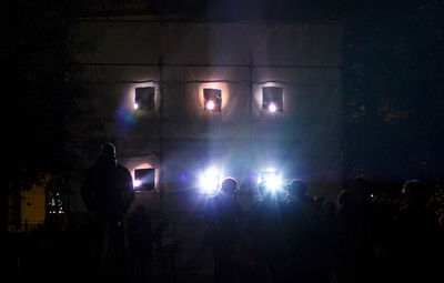 Silhouette of people at night