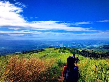 Scenic view of landscape against cloudy sky